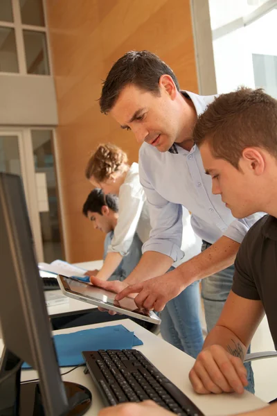 Educator helping student in training class