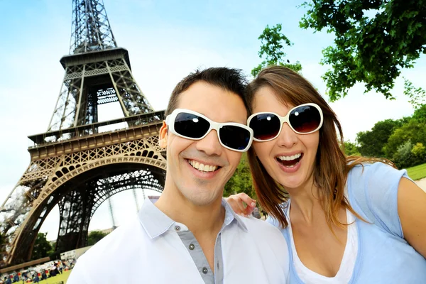 Funny couple in front the Eiffel Tower