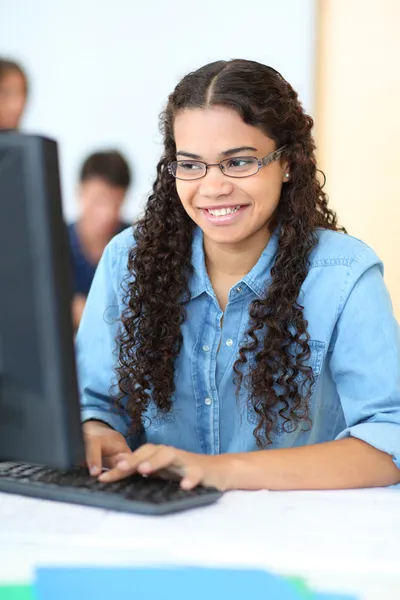 Portrait of teenager in computing class