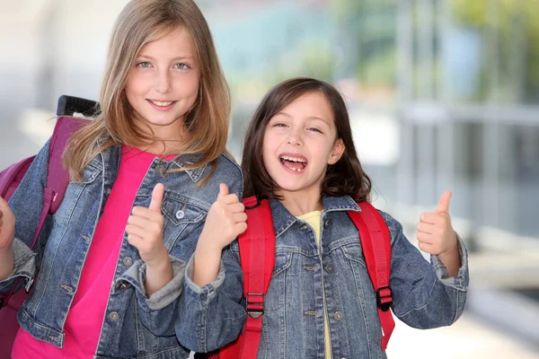 Cheerful grade-schoolers going back to school