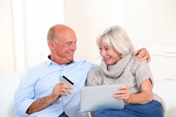 Senior couple doing online shopping