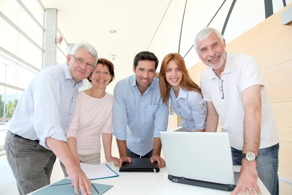 Group of happy senior in training course