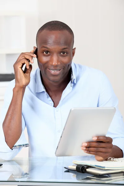 Salesman in office talking on the phone