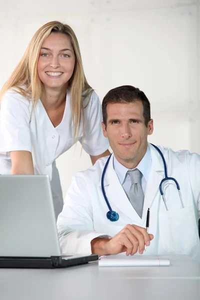 Closeup of doctor and nurse in the office