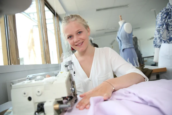 Young girl in sewing training course