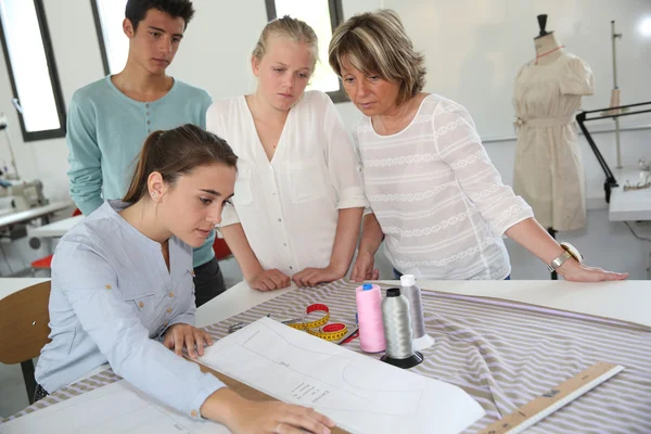 Students in dressmaking training school