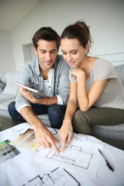 Couple searching ideas to decorate new home