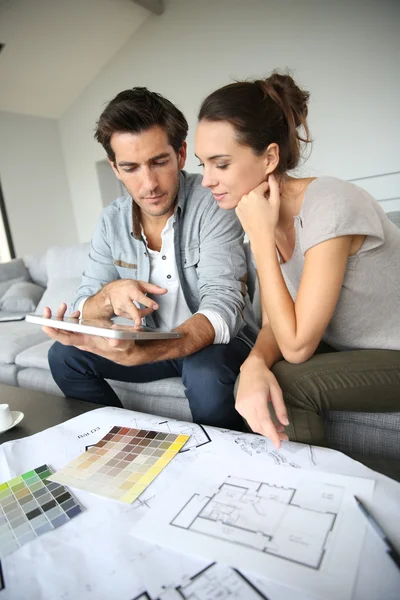 Couple searching ideas to decorate new home