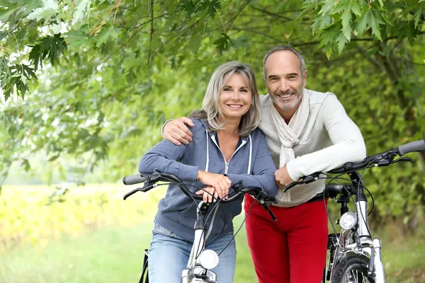 Senior couple with bicycle