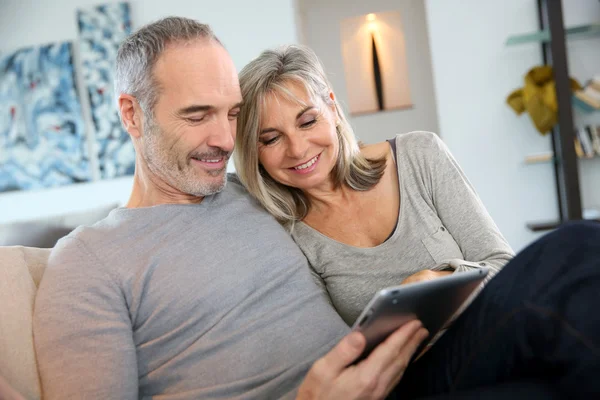 Mature couple with tablet