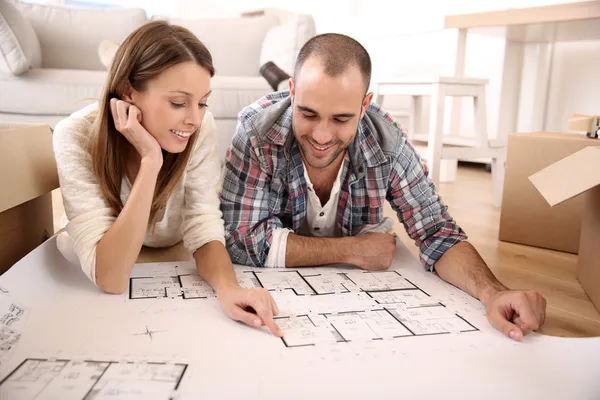Couple looking at house plan