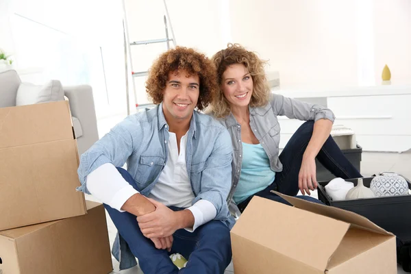 Couple getting in new apartment