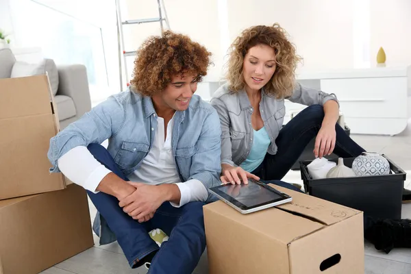 Couple getting in new apartment