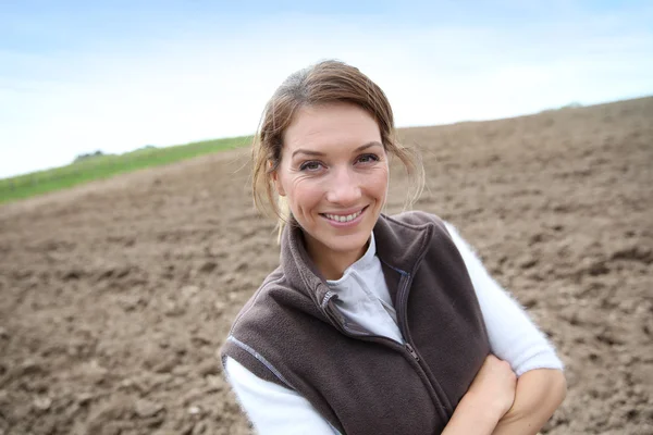 Woman standing on farming land