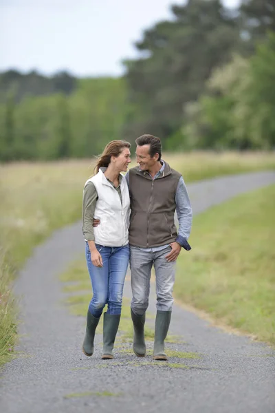 Couple walking in countryside