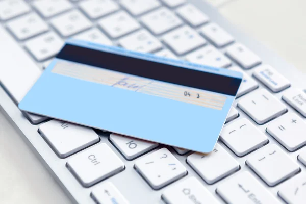 Closeup of credit card on a pc keyboard.