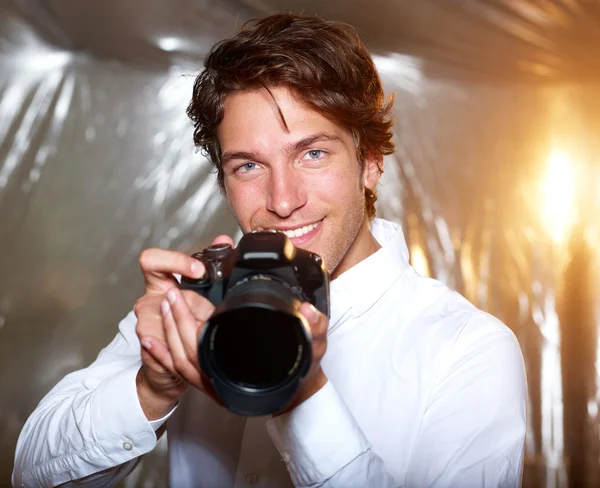 Young handsome photographer
