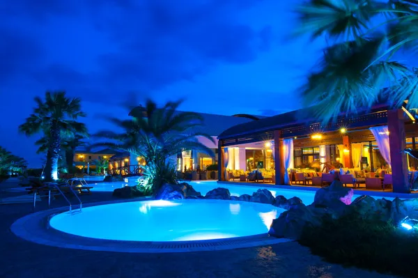 Night pool side of rich hotel