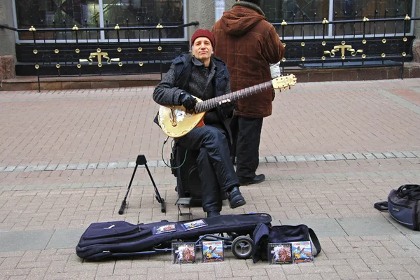 Street musician playing on the Arbat street Moscow