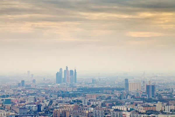 Yellow smog autumn sunset under Moscow city