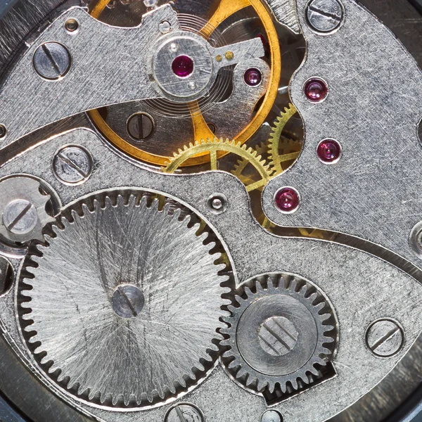 Clockwork of wristwatch with gears, spring