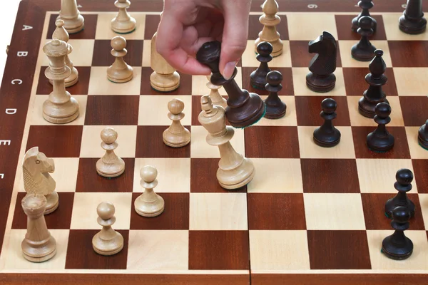 Black king knocks white king in chess game