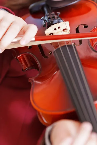 Girl playing fiddle - violin strings and bow