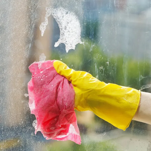 Cleaning window glass by soap suds water