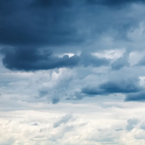 Dark blue rainy clouds in overcast sky