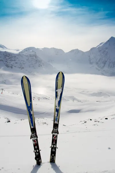 Ski, skiing, winter season , mountains and ski equipment on ski run