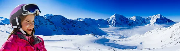 Ski, winter fun - lovely skier girl enjoying ski holiday