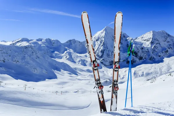 Skiing, winter season , mountains and ski equipments on ski run