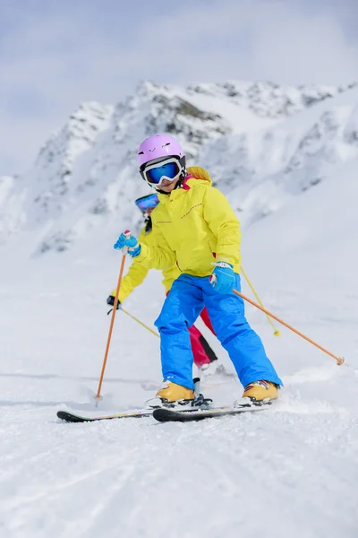 Skiing, winter, ski lesson - skiers on ski run