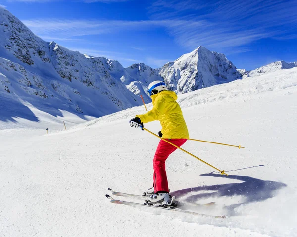 Skiing, skier, winter sport - woman skiing downhill