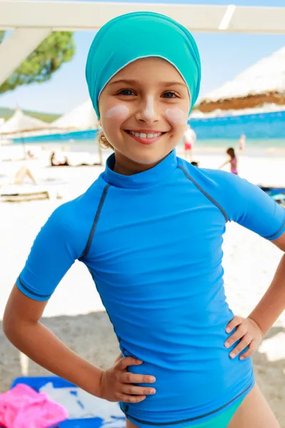 Summer beach - young surfer girl on the beach