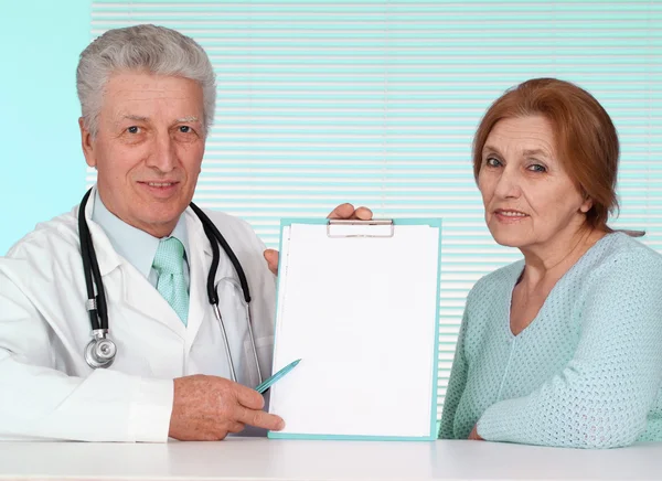 Caucasian aged doctor with a aged patient