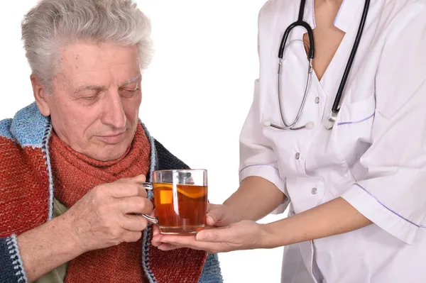 Doctor treats sick elderly man