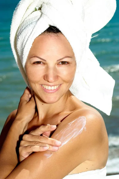 Friendly woman enjoying the sea breeze