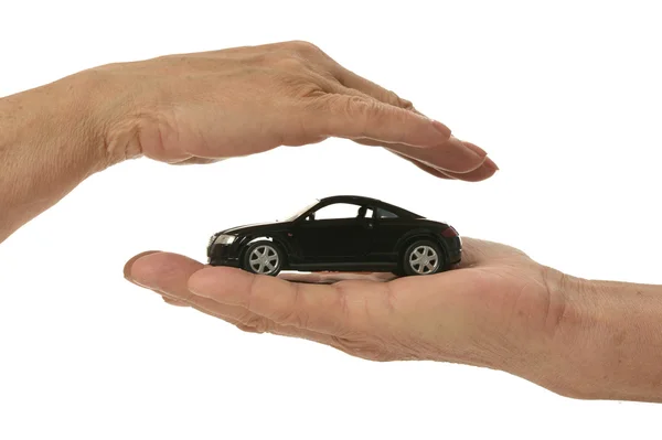 Hands with miniature car