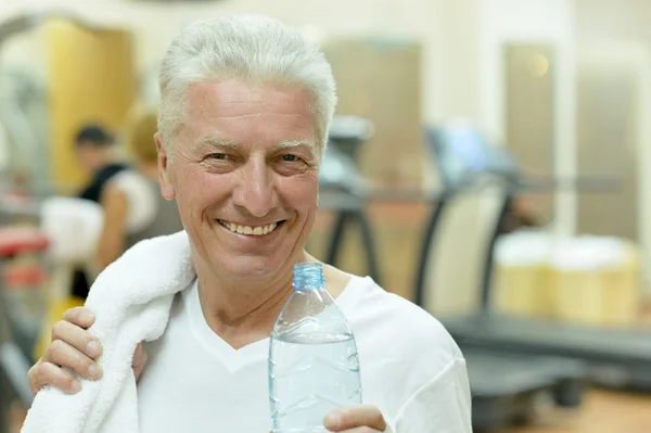 Elderly man in a gym