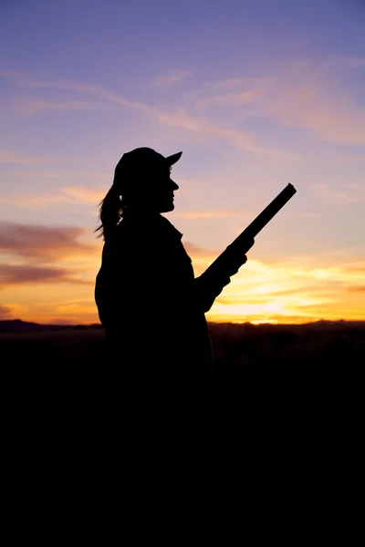 Hunter and Shotgun in Sunset