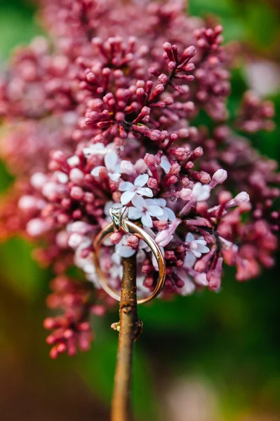 Lilac flower and engagement ring