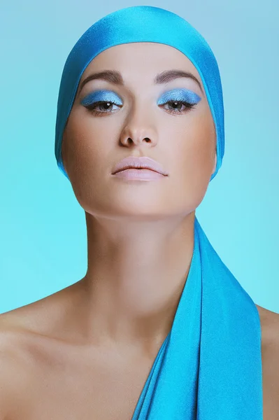 Young woman in blue scarf on the head with health skin of face