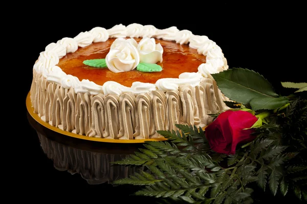 San marcos cake with a flower, isolated on black