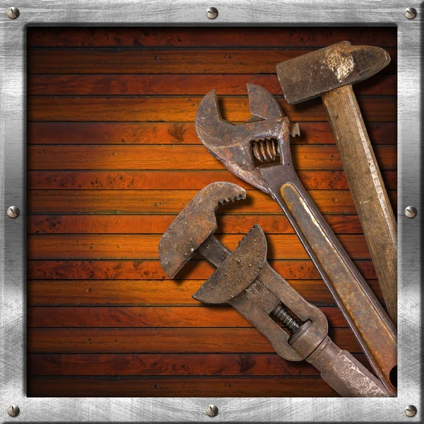 Set of Old Tools on Wood Panel