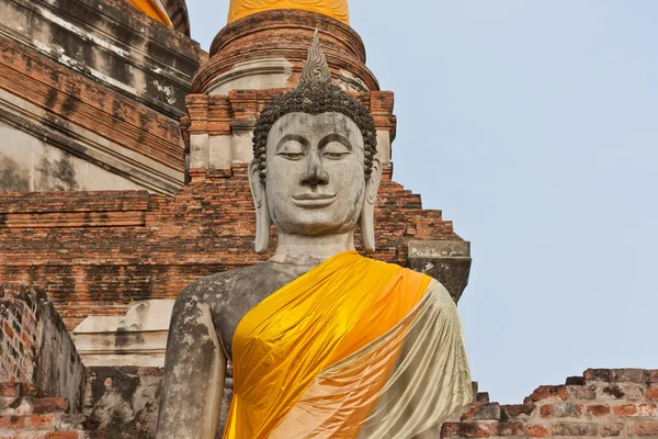The big ancient buddha statue in ruined old temple