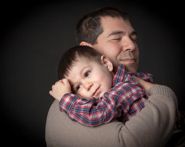 The hug- father and son.