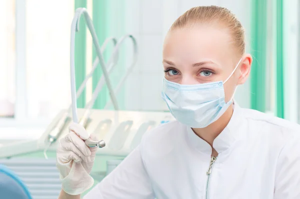 Female dentists in protective mask