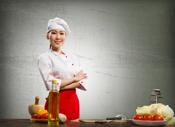 Asian cook woman crossed her arms