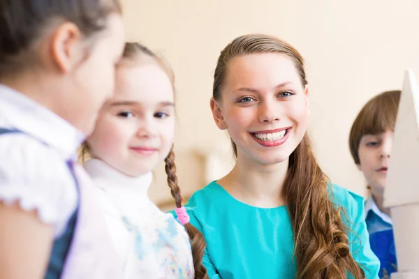 Children draw with the teacher